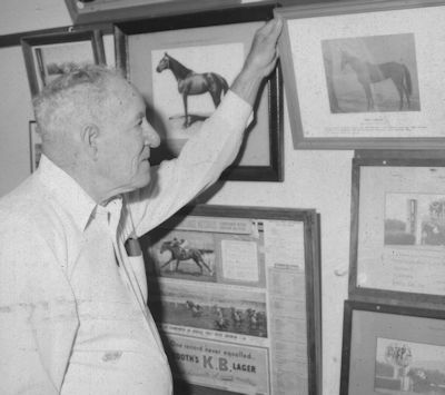 Frank Stewart with some of the images housed at the Central Queensland Racing Hall of Fame and Museum
