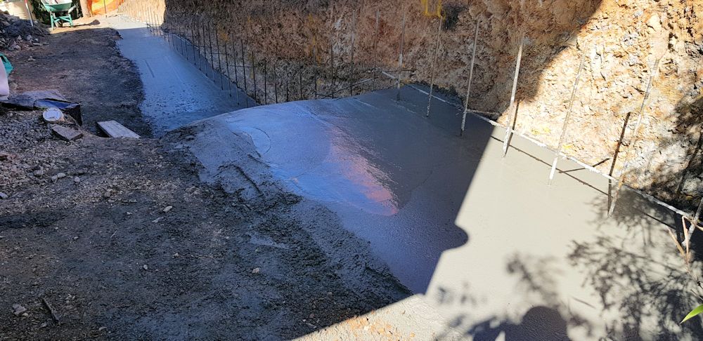  pouring the footings for the retaining wall.