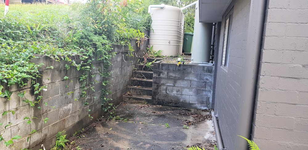 Side of house as the existing wall looked before demolition.