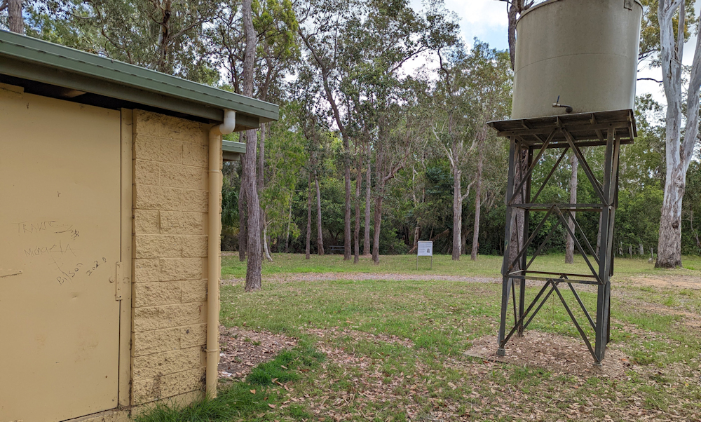 The defunct toilet block and water tank on the site once occupied by a eucalyptus oil-producing plant